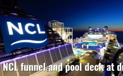 NCL funnel and pool deck at dusk Norwegian Bliss