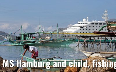 MS Hamburg and child, fishing village near Coron, Busuanga Island, Philippines MS Hamburg and child, fishing village near Coron, Busuanga Island, Philippines