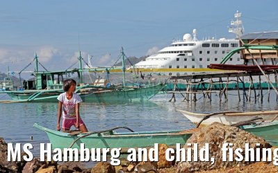 MS Hamburg and child, fishing village near Coron, Busuanga Island, Philippines MS Hamburg and child, fishing village near Coron, Busuanga Island, Philippines