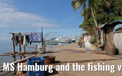 MS Hamburg and the fishing village near Coron, Busuanga Island, Philippines MS Hamburg and the fishing village near Coron, Busuanga Island, Philippines