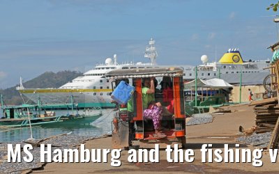 MS Hamburg and the fishing village near Coron, Busuanga Island, Philippines MS Hamburg and the fishing village near Coron, Busuanga Island, Philippines