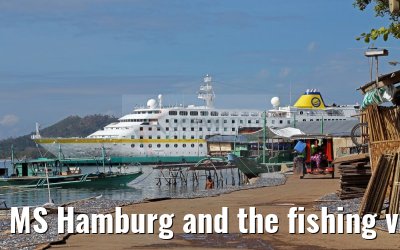 MS Hamburg and the fishing village near Coron, Busuanga Island, Philippines MS Hamburg and the fishing village near Coron, Busuanga Island, Philippines