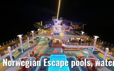 Norwegian Escape pools, water slides, climbing park at night