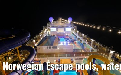 Norwegian Escape pools, water slides, climbing park at night
