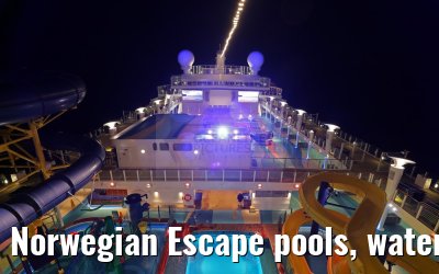 Norwegian Escape pools, water slides, climbing park at night