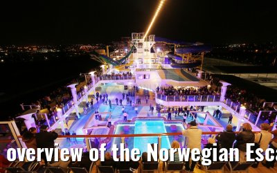 overview of the Norwegian Escape pool deck at night