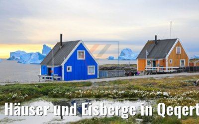 Häuser und Eisberge in Qeqertarsuaq, Grönland