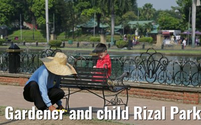 Gardener and child Rizal Park Manila 14.02.2016