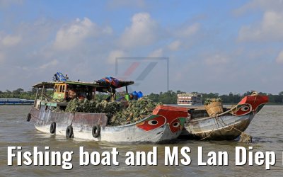 Fishing boat and MS Lan Diep near Cai Be, Vietnam 09.04.2017