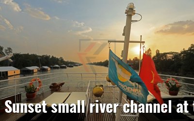 Sunset small river channel at the city of Chau Phong, Vietnam 27.04.2017